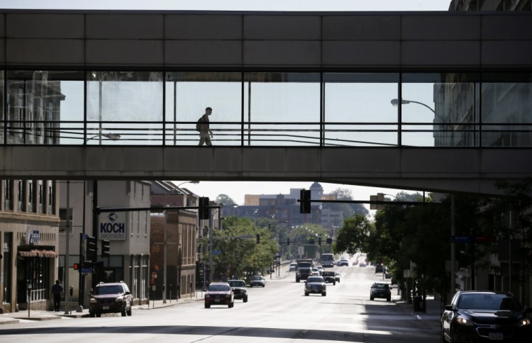 Skywalks like this one over a downtown street in Des Moines, Iowa, have created a dilemma for cities: how to create lively streets when fewer people walk outside.