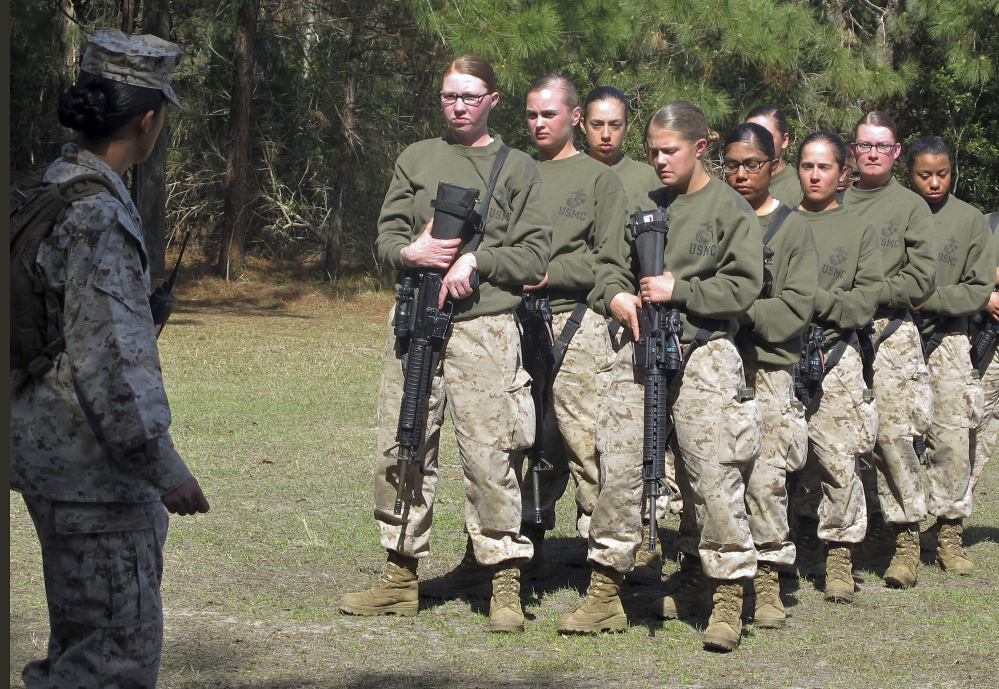 Recruits stand at a Marine training center in South Carolina in 2013. Nearly 86 percent of women recently failed combat-readiness tests, while less than 3 percent of men did. Associated Press/Bruce Smith