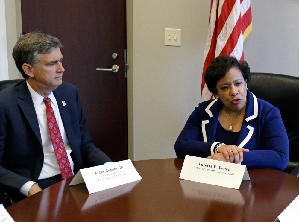 Attorney General Loretta Lynch, right, conducts a meeting Tuesday in Orlando, Fla., with U.S. Attorney Lee Bentley concerning the Pulse nightclub mass shooting.