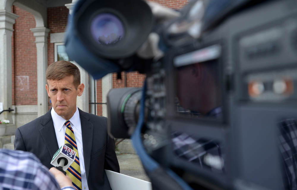Walter McKee, Claudia Viles' defense attorney, speaks with news media representatives Wednesday after his client was convicted in Somerset County Superior Court in Skowhegan.