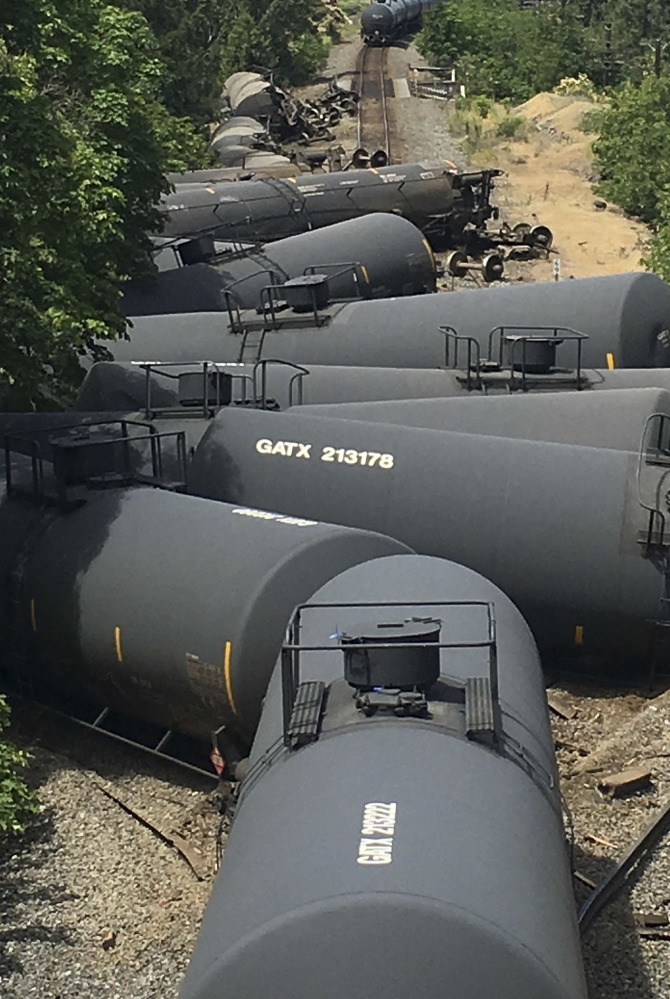 Tank cars carrying oil are shown after a train derailed near Mosier, Ore., on June 3.