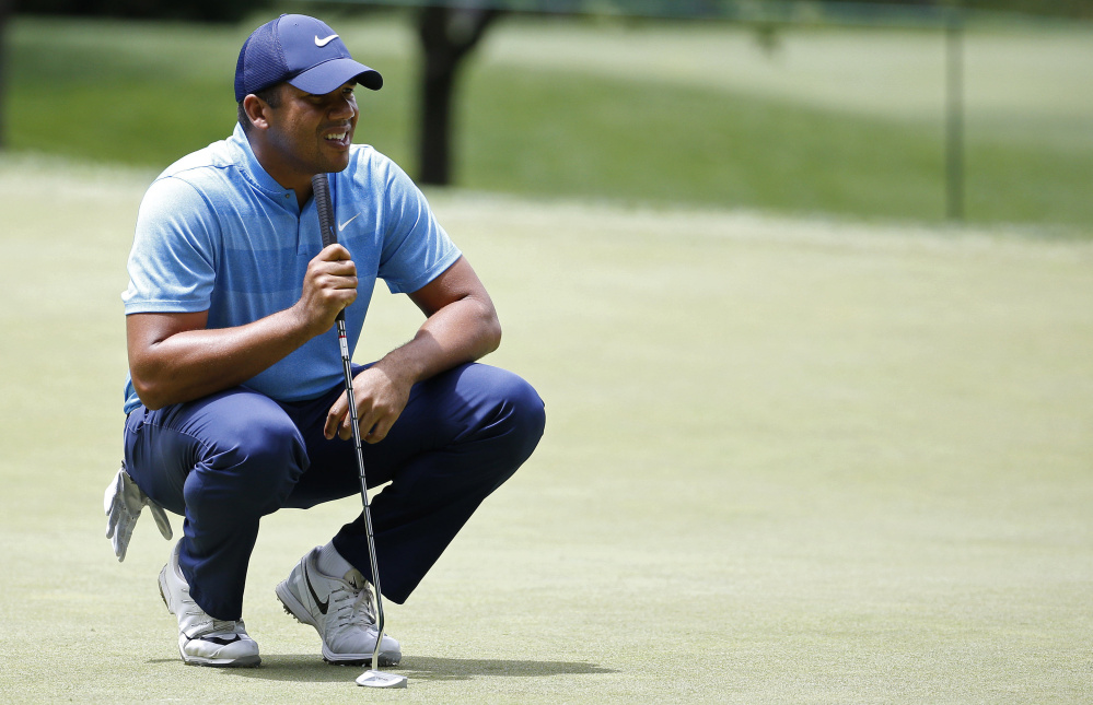 Jhonattan Vegas of Venezuela lines up a putt on the 13th hole during the first round of the Quicken Loans National golf tournament at Bethesda, Maryland. Vegas shot a 65 and trails leader Jon Rahm by one stroke at Congressional Country Club.