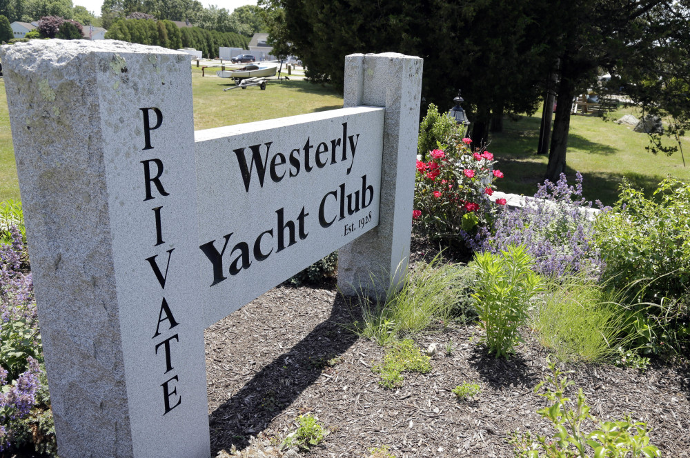 In this Monday, June 20, 2016 photo, a granite sign outside the Westerly Yacht Club is seen in Westerly, R.I. Wives can join the club as associate, non-voting members, but unmarried women can't. A vote to change the nearly century-old policy failed last week, with 171 men voting to uphold it. Women, and many men, are not happy. (AP Photo/Elise Amendola)