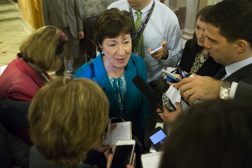 Sen. Susan Collins, R-Maine, center, led a bipartisan effort to craft a Senate gun-control bill that would make it possible to deny firearms to people on two FBI lists.