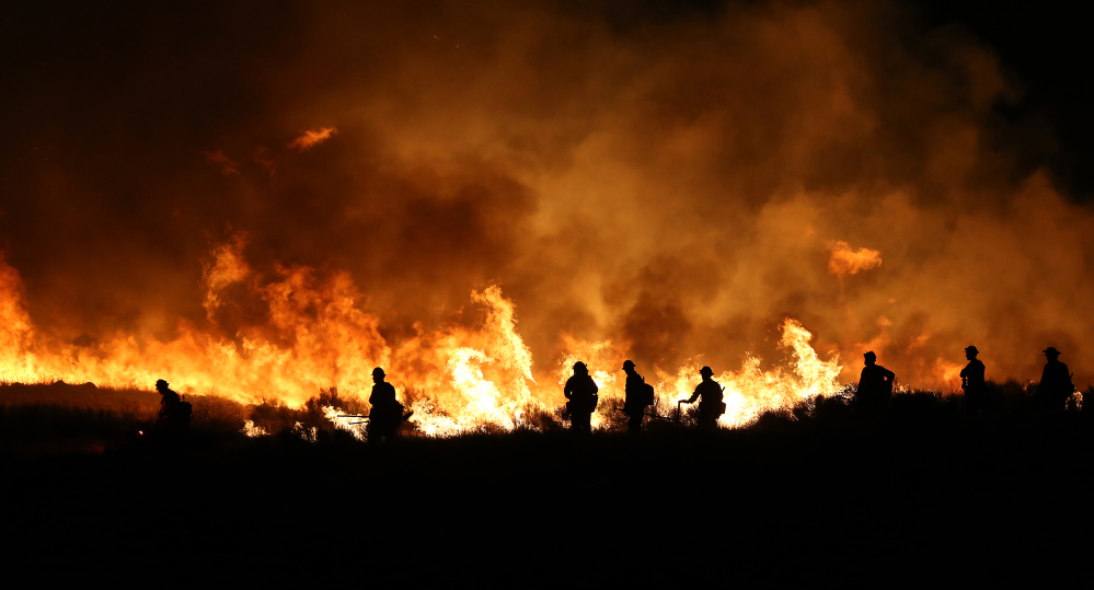 Firefighters light backfires Thursday to counter a fast-moving, ferocious fire near Lake Isabella, Calif., as scorching heat and tinder-dry conditions create dangerous conditions.
Associated Press/Casey Christie, The Bakersfield Californian