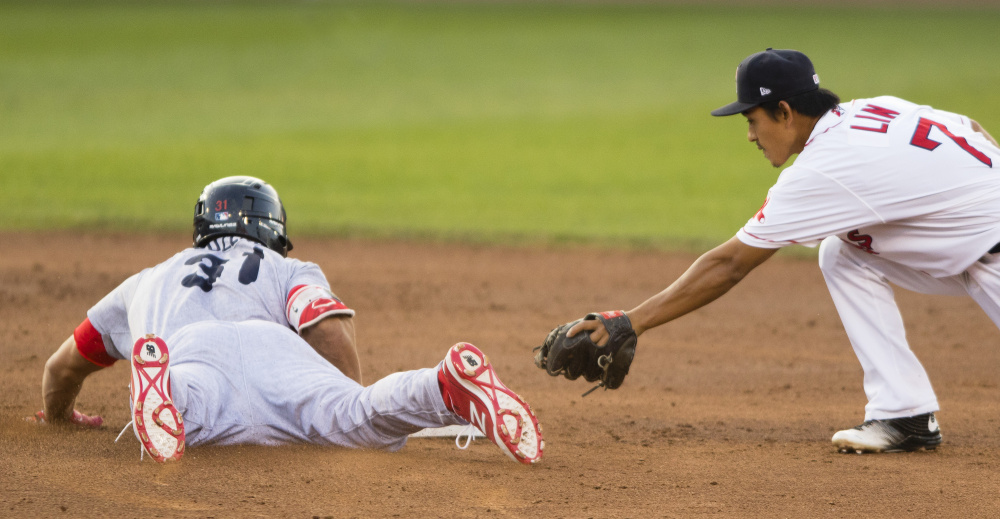 Portland's Tzu-Wei Lin is late with the tag as Reading's Dylan Cozens slides safely into second with a third-inning double at Hadlock Field on Friday, 
Carl D. Walsh/Staff Photographer