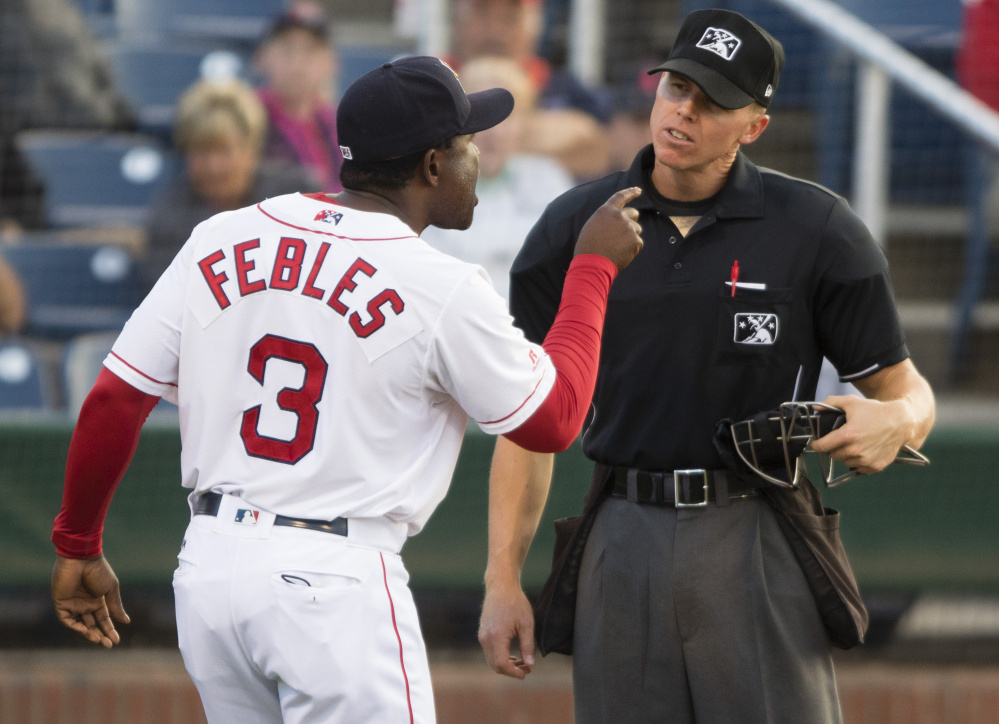 Portland Sea Dogs Manager Carlos Febles argues with plate umpire Chris Graham after being ejected for disputing balls and strikes Friday night during the third inning of an 11-3 loss to Reading at Hadlock Field. It was Febles' second ejection this year.