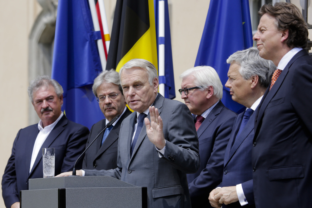 The foreign ministers from the European Union's founding six nations, Jean Asselborn from Luxemburg, Paolo Gentiloni from Italy, Jean-Marc Ayrault from France, Frank-Walter Steinmeier from Germany, Didier Reynders from Belgium and Bert Koenders from the Netherlands, brief the media after a meeting on the Brexit vote, in Berlin on Saturday.