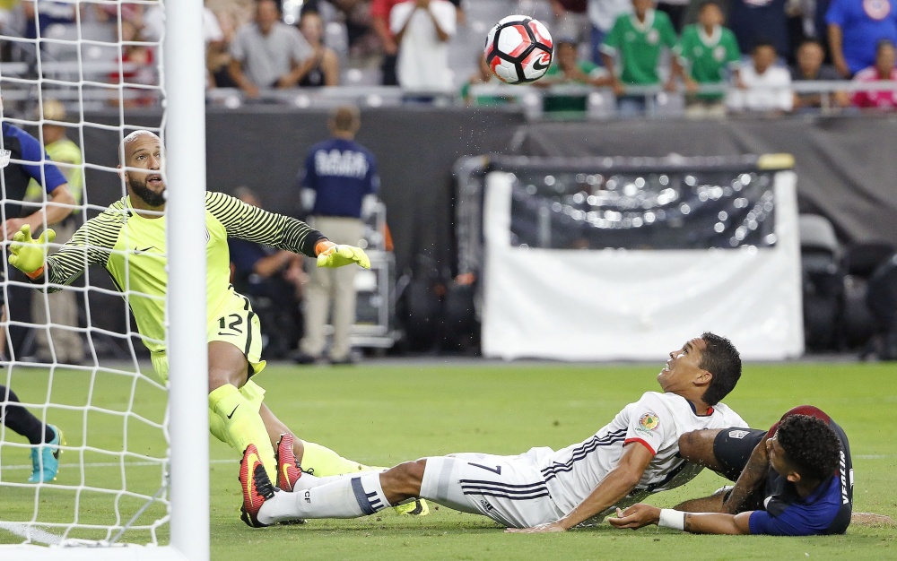 Colombia's Carlos Bacca sends the ball past U.S. goalkeeper Tim Howard for the only goal Saturday night in the Copa America third-place game in Glendale, Ariz.