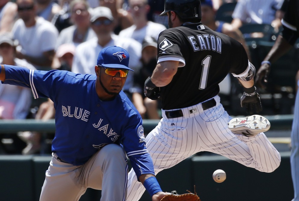 Adam Eaton of the White Sox is safe with a single as Blue Jays first baseman Edwin Encarnacion reaches for the late throw during Toronto's 10-8 win Saturday.