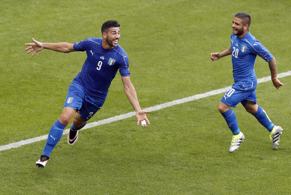 Graziano Pelle, left, celebrates with Lorenzo Insigne after scoring the clinching goal in Italy's 2-0 win over Spain in Saint-Denis, France.
