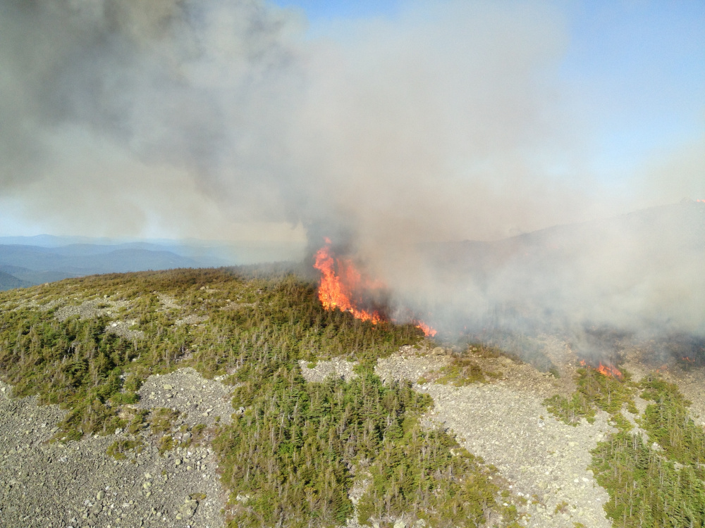 Fire burns near the summit of Mount Abraham on Sunday. The fire was still going Monday night.