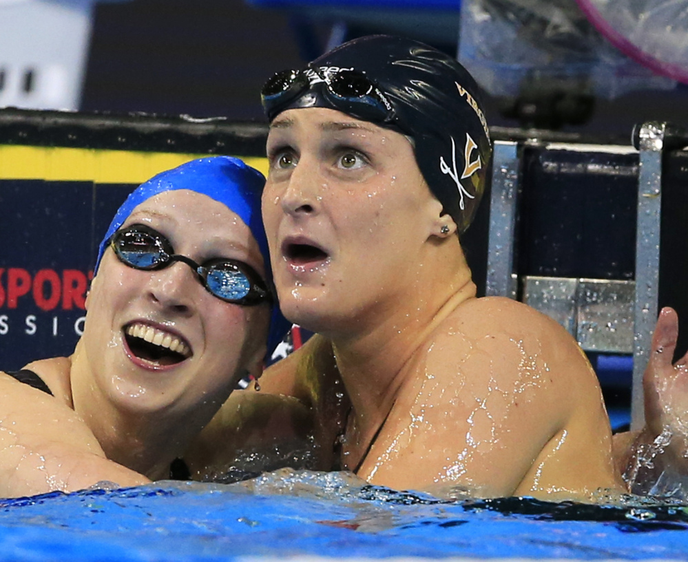 Katie Ledecky, left, reacts with Leah Smith after winning the 400-meter freestyle final Monday night at the U.S. Olympic swimming trials. Smith was second and will be on the team.
