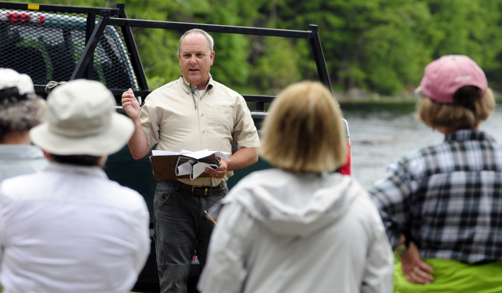 Department of Inland Fisheries and Wildlife biologist G. Keel Kemper talks to people before a tour of Jamies Pond Wildlife Management Area in Hallowell on Tuesday.