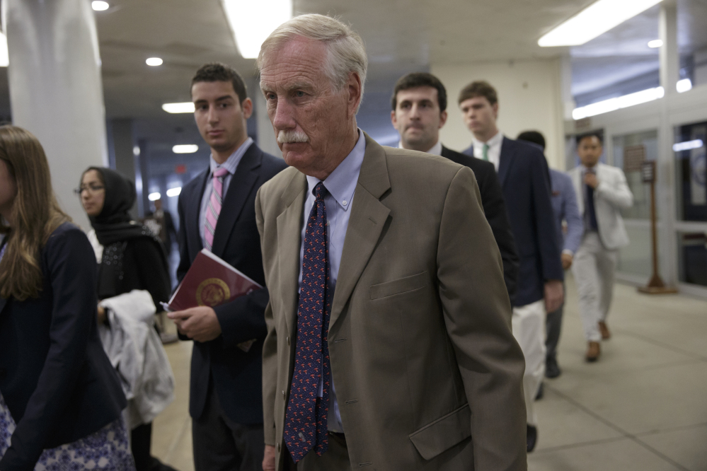 Sen. Angus King, I-Maine, and other senators head to the Senate chamber on Capitol Hill in Washington on Wednesday to vote on a rescue package for debt-stricken Puerto Rico, just two days before the island is expected to default on a $2 billion debt payment.