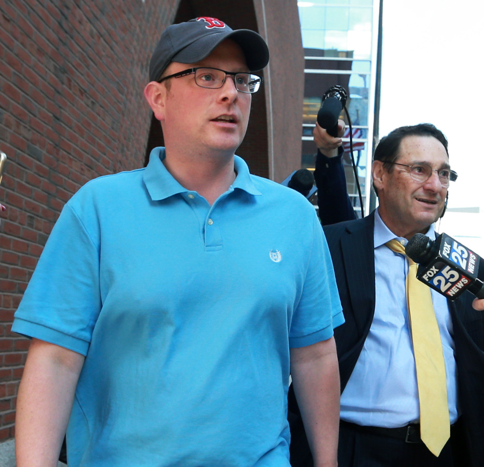 Timothy Sullivan leaves the Moakley Federal Courthouse in Boston on Wednesday after his arraignment.