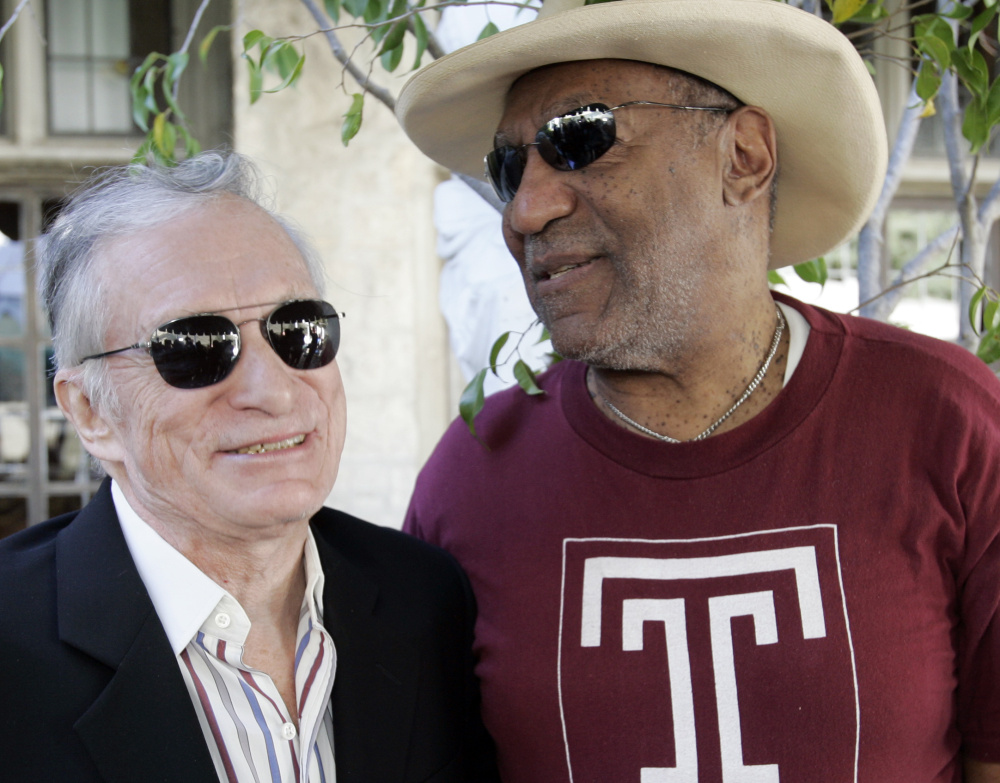 Bill Cosby and Hugh Hefner greet each other at a party in 2008.Hefner says the lawsuit against him is barred by the statute of limitations and is not supported by facts.