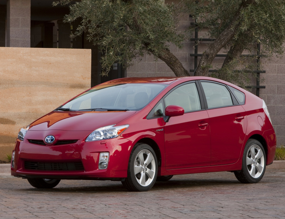 Toyota is recalling 1.4 million Prius hybrid cars from 2009 through 2015 over concerns that the side curtain air bags could inflate without cause. A separate recall involves possible fuel tank cracks.