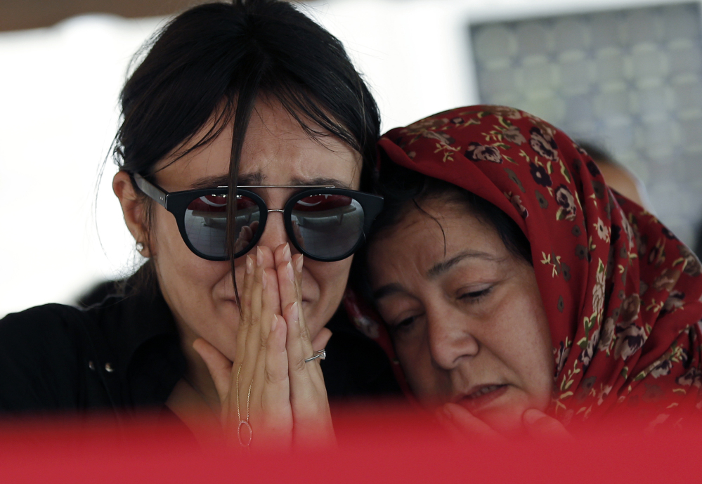Mourners attend the funeral for Gulsen Bahadir, 28, a Turkish Airlines flight attendant who was killed in Tuesday's terror attack.