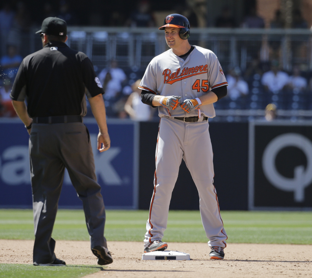 Baltimore Orioles' Mark Trumbo stands on second base after hitting a double during the ninth inning of Wednesday's 12-6 victory at San Diego.