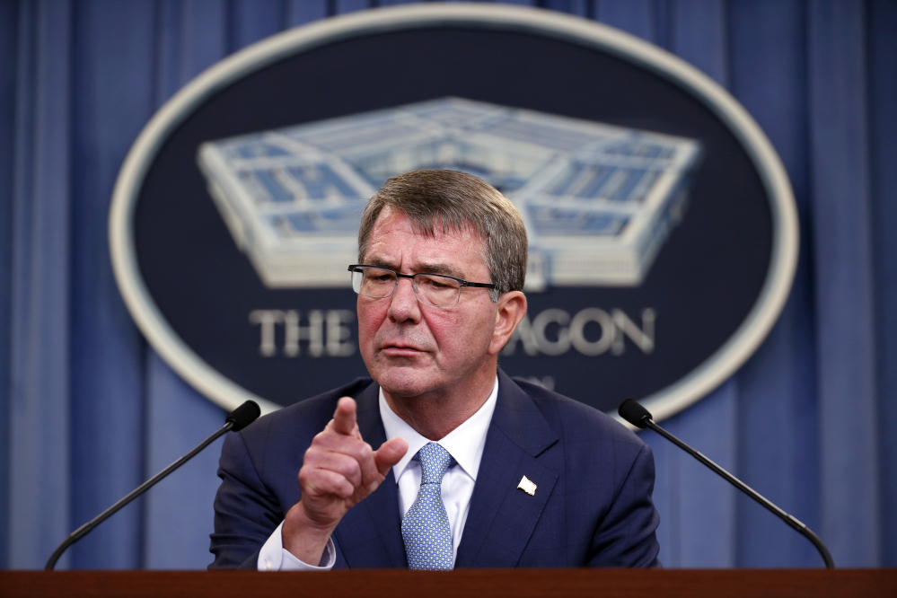 Defense Secretary Ashton Carter takes a question at a news conference at the Pentagon on Thursday while announcing new rules allowing transgender people to serve openly in the U.S. military. "Our mission is to defend this country," he said, "and we don't want barriers unrelated to a person's qualification to serve."
