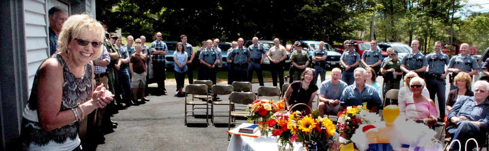 Becky Berry, administrative assistant to the Maine State Police Troop C commander, speaks at her retirement party Thursday in Skowhegan. She was honored for 36 years of service.