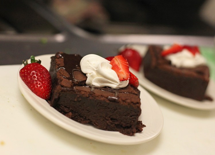 Fudge brownies topped with fresh strawberries and whipped cream at Mercy Hospital.