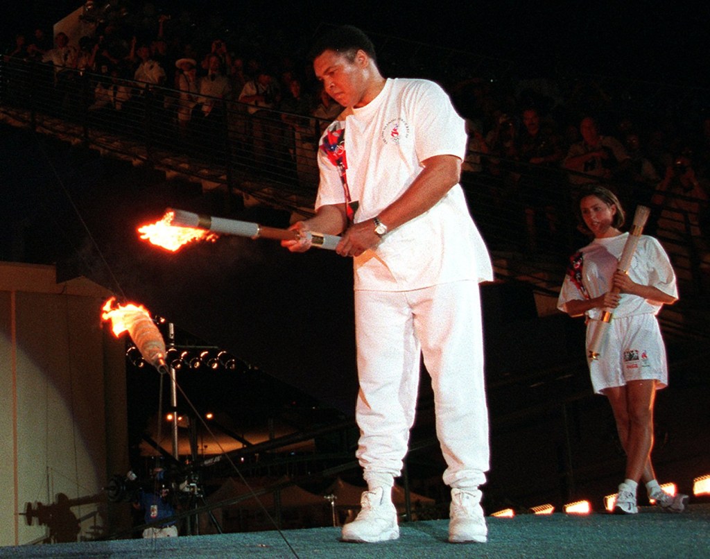 Muhammad Ali lights the Olympic flame during the 1996 Summer Olympic Games opening ceremony in Atlanta.