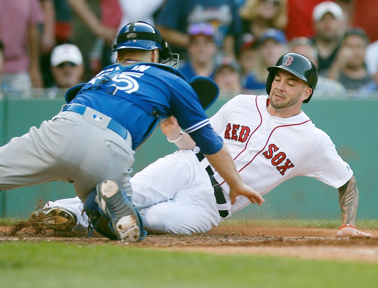 Blake Swihart, seen scoring in a game in Boston in June, started last season as the starting catcher for the Red Sox. From there, we went to Pawtucket, to left field and to the disabled list. Now, he’s back as a catcher.