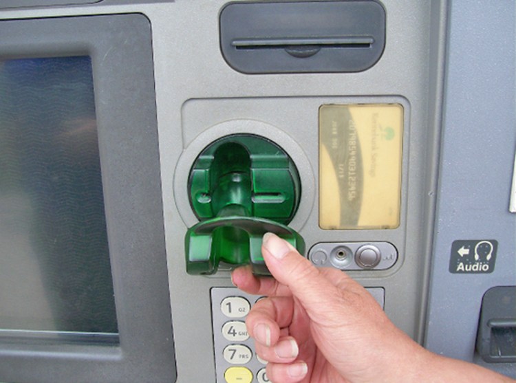 A skimmer device can record an ATM card's information to hack into the account. The one seen here was found on a Kennebunk Savings Bank ATM in June 2016.