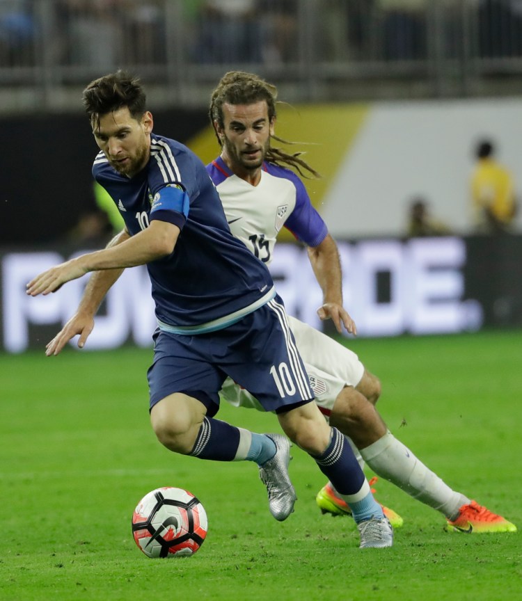 Lionel Messi gets the ball past U.S. midfielder Kyle Beckerman as Argentina was a step ahead of the Americans most of the night.   Associated Press/David J. Phillips