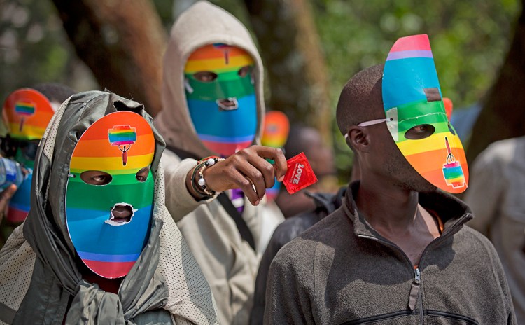 Kenyan gay men,  lesbians and others wear masks to preserve their anonymity as they protest in February 2014 against Uganda's increasingly tough stance forbidding homosexuality. In the current case, two men accused of engaging in gay sex could face 14 years in jail if convicted. Associated Press