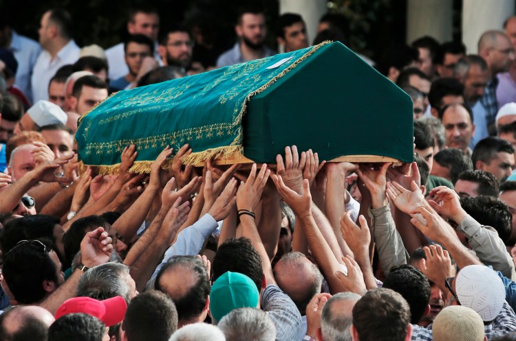 Mourners carry the coffin of Muhammed Eymen Demirci during s funeral in Istanbul's Basaksehir neighborhood. Demirci was killed Tuesday in the blasts in Istanbul's Ataturk airport. He was 25 years old and worked for ground services at the airport. Associated Press/Lefteris Pitarakis