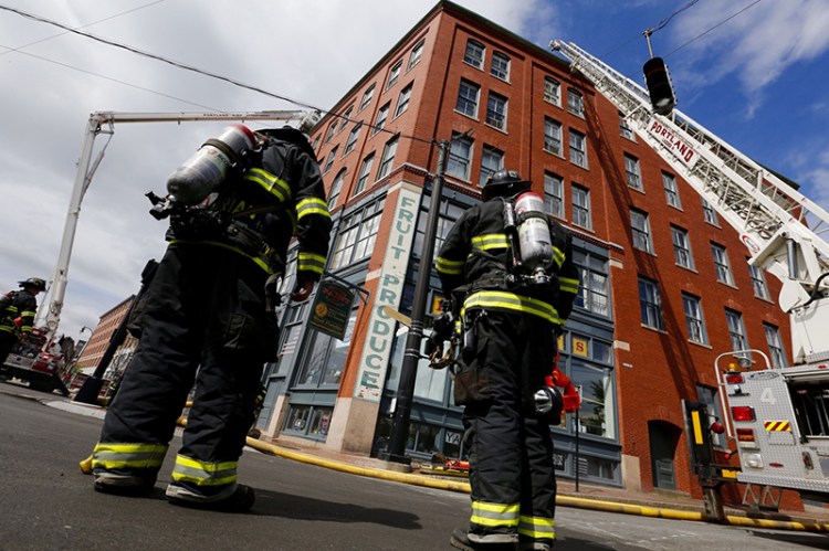 Firefighters at the scene of reported fire at 305 Commercial Street Friday morning.
