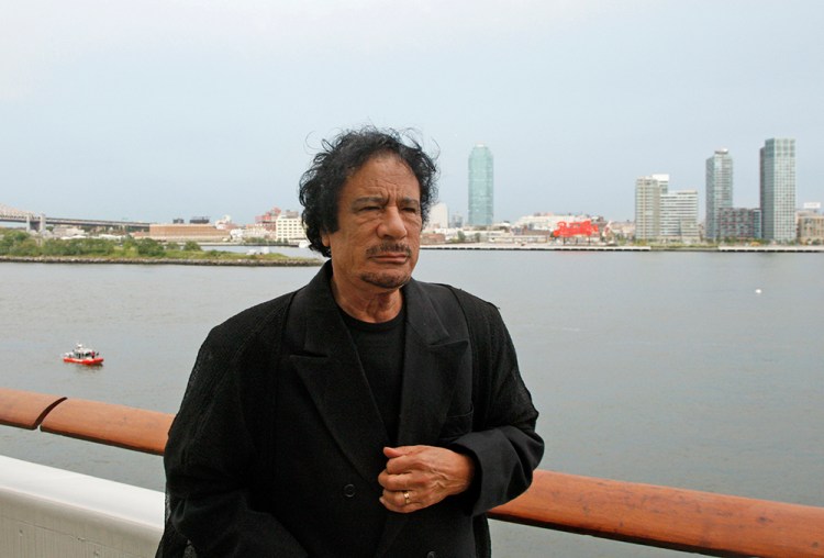 Libyan leader Moammar Gadhafi stands near a railing during a visit to New York in this Sept. 22, 2009, photo. Gaddafi was having a tent pitched on suburban New York property owned by Donald Trump until local officials stopped the work because it violated regulations. Gaddafi, known for pitching his large Bedouin tent on his trips abroad, was scheduled to address the U.N. General Assembly the next day. U.N. photo via Reuters