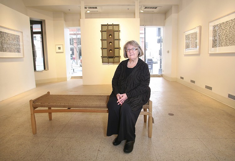 June Fitzpatrick sits in her gallery at 522 Congress St. in Portland in February 2010. Fitzpatrick was among the inaugural participants in Portland's First Friday Art Walk and is the last of the original participants still active in the monthly art event. Tim Greenway/Staff Photographer