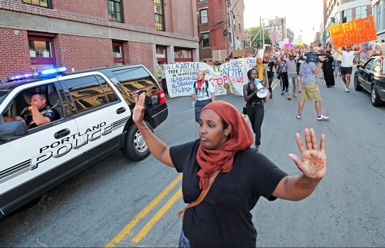 Shadiyo Hussain chants, “Hands up, don’t shoot!” with about 150 people as they march from Lincoln Park down Pearl Street to Commercial Street for a Black Lives Matter protest on July 15, 2016. The arrests made soon after began a court case that now appears to be over.
