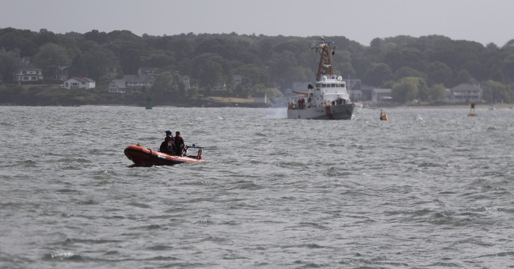 Rescue boats are seen in Casco Bay as emergency crews remove people from a capsized boat on Saturday.