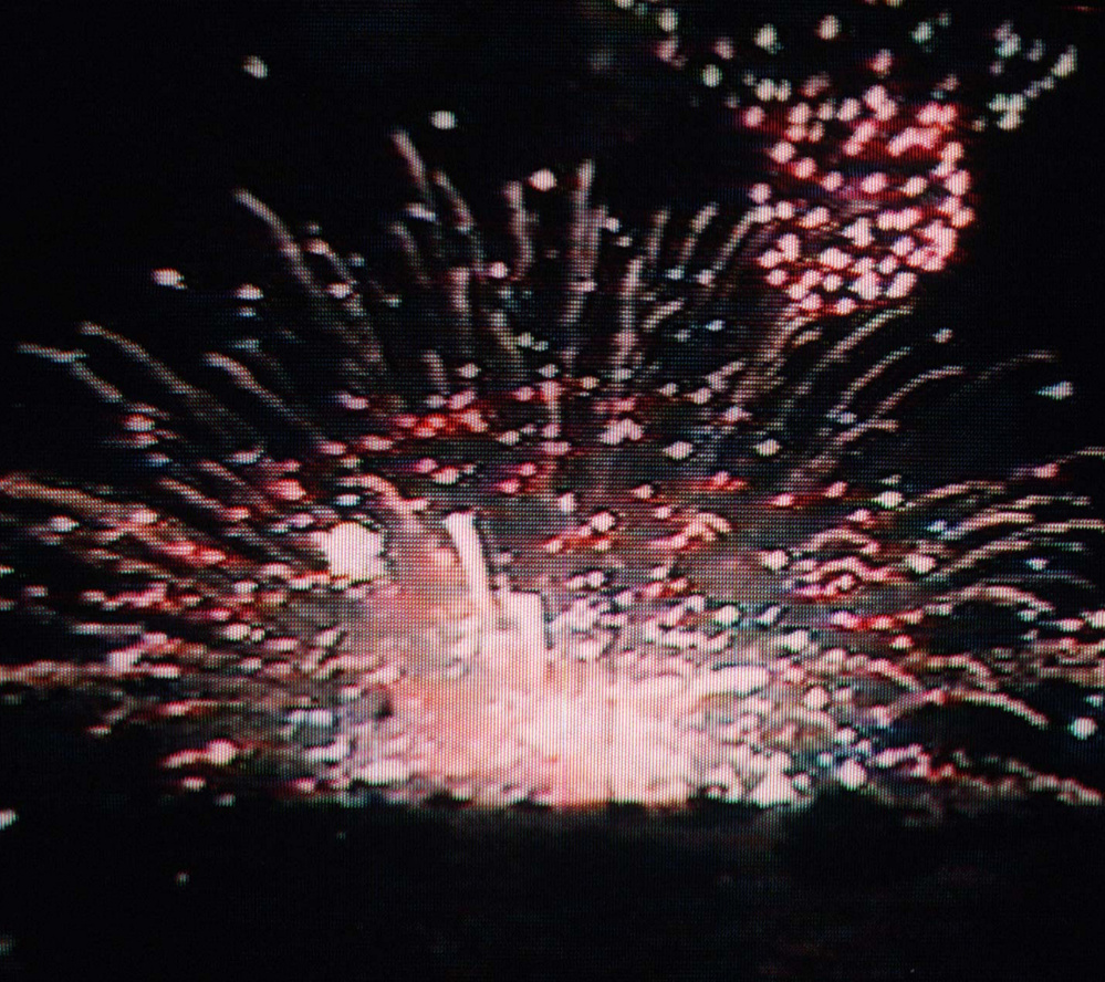 A defective shell explodes on the ground, igniting fireworks yet to be lit on July 5, 1997.