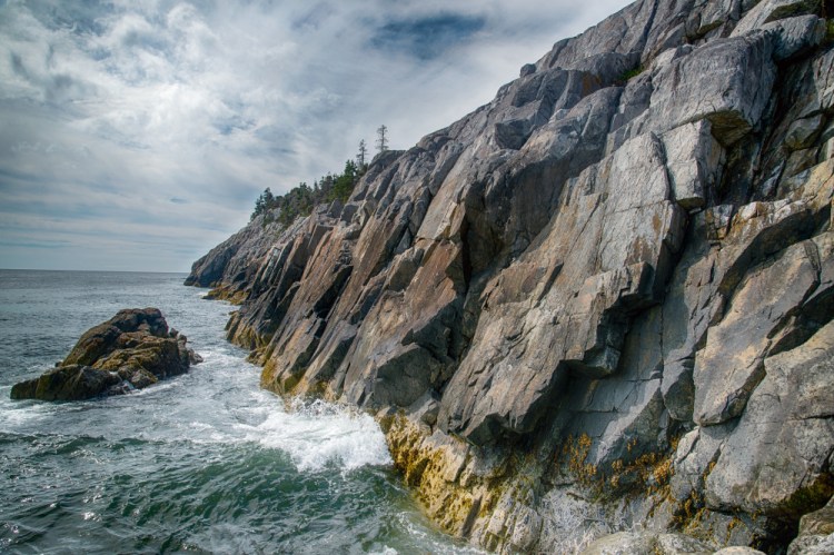 Coastal cliffs on Isle au Haut, as seen in the new book "Acadia National Park: A Centennial Celebration."
