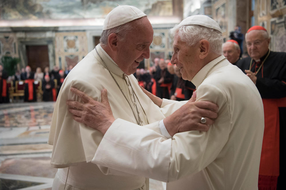 Pope Francis, left, and retired Pope Benedict XVI embrace during a ceremony to celebrate Benedict's 65th anniversary of his ordination as a priest at the Vatican on Tuesday.