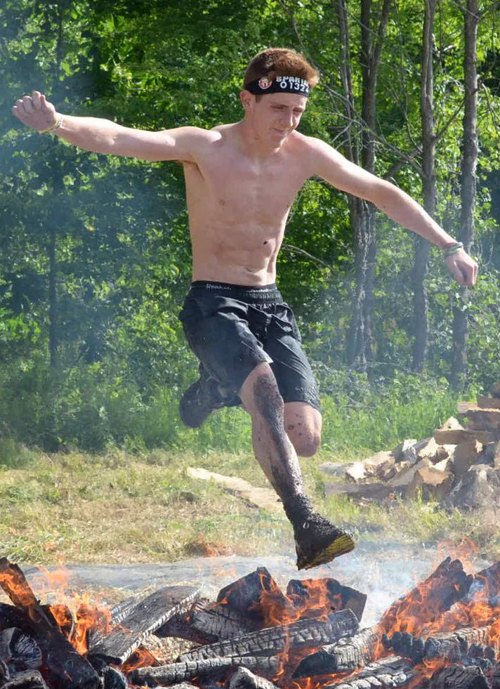 Isaac Douglass, 18, will jump over fire, crawl under barbed wire, and all else needed to compete in a Spartan Race.
