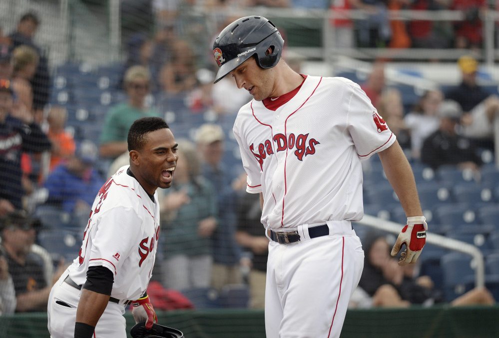 Nate Freiman, right, is greeted at by Sea Dogs' teammate Aneury Tavarez after Freiman hit his second home run of the game in Portland's 6-2 win over the Hartford Yard Goats in the first game of a doubleheader Friday at Hadlock Field.
