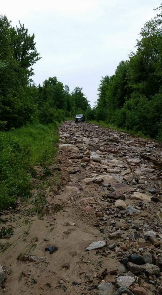 Old Spencer Road in northern Somerset County is washed out and littered with rocks after Tuesday's storm.