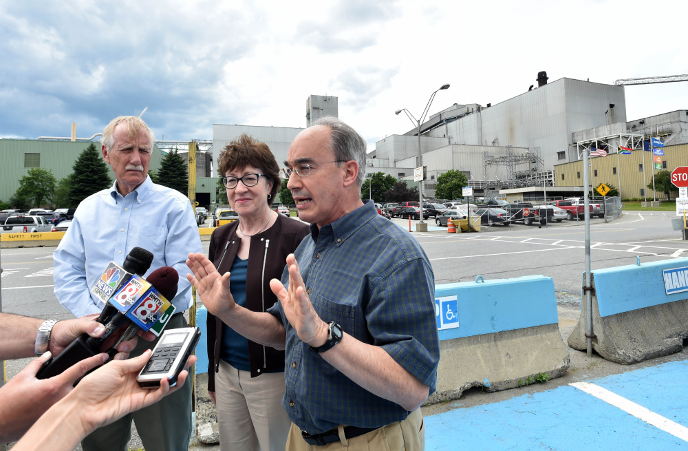 From left, Sen. Angus King, Sen. Susan Collins and Rep. Bruce Poliquin speak Friday after a tour of Sappi Fine Paper in Skowhegan. They were at the paper mill to highlight creation of a federal team that will look at the future of the forest products industry.