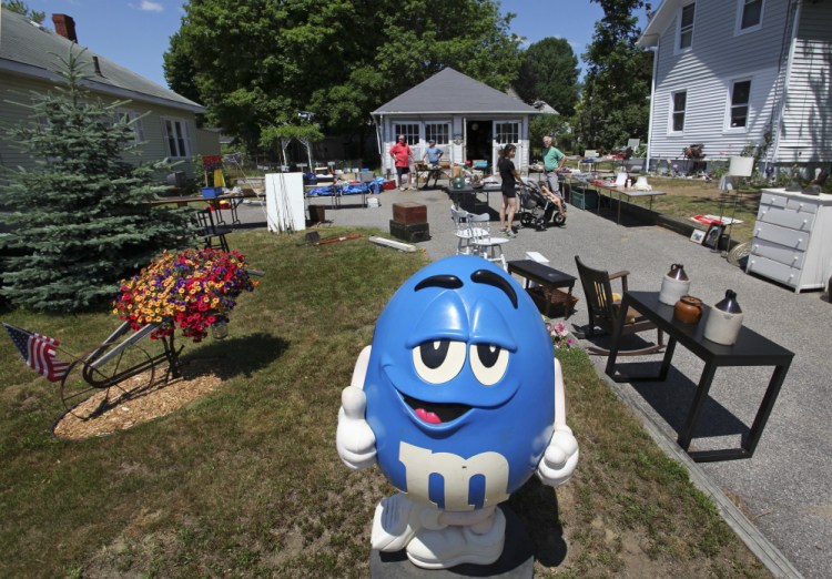 An M&M character may melt the hearts of prospective shoppers at Jim Quatrano's recent yard sale in South Portland.