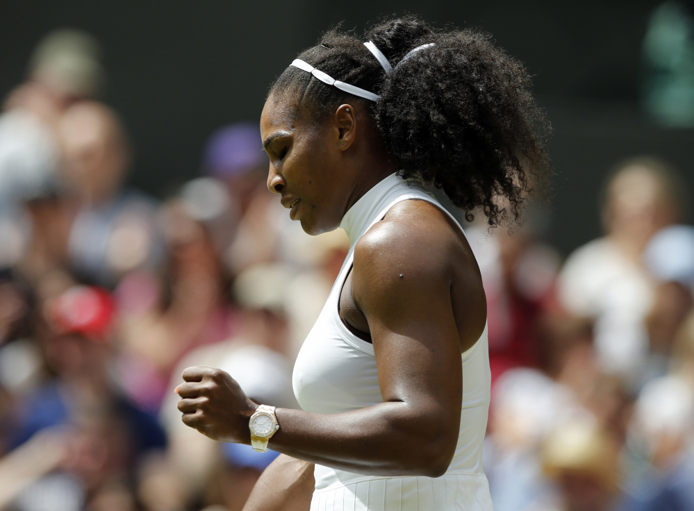 Serena Williams celebrates a point against Annika Beck during their women's singles match Sunday at Wimbledon.