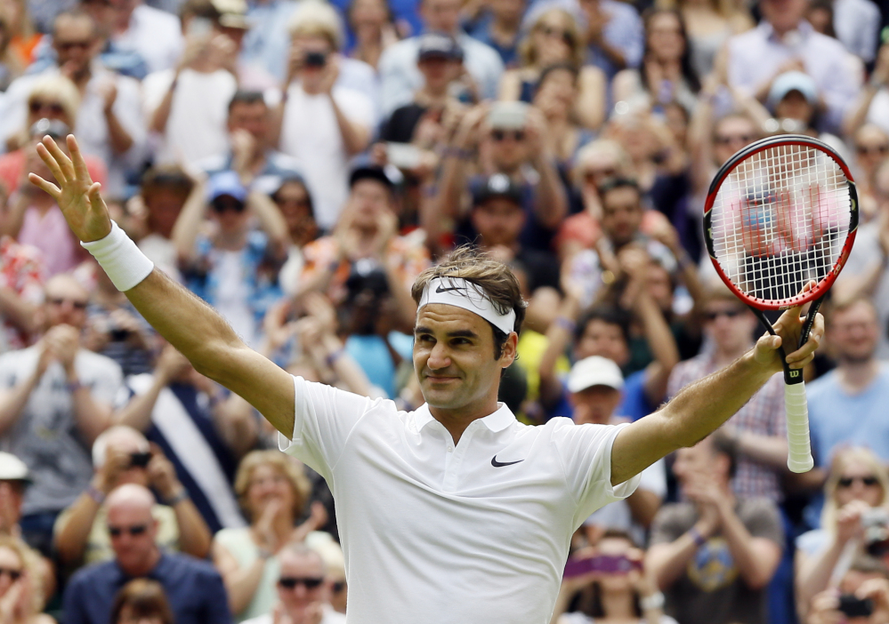 Roger Federer celebrates after beating Steve Johnson and moving into the Wimbledon quarterfinals for the 14th time in his career.
