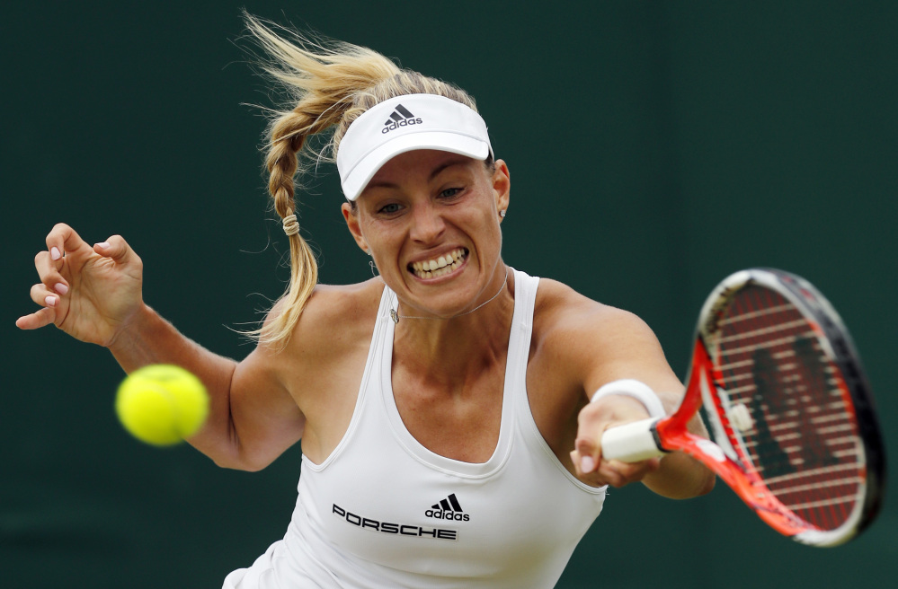 Angelique Kerber of Germany returns to Misaki Doi of Japan during their match Monday in the Wimbledon Tennis Championships in London. Kerber won easily, 6-3, 6-1, to move into the quarterfinals.