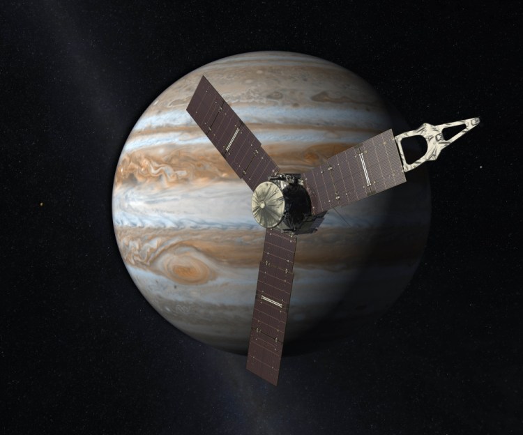 This artist's rendering provided by NASA and JPL-Caltech shows the Juno spacecraft above Jupiter. Five years after its launch from Earth, Juno was scheduled to go into orbit around the planet on Monday